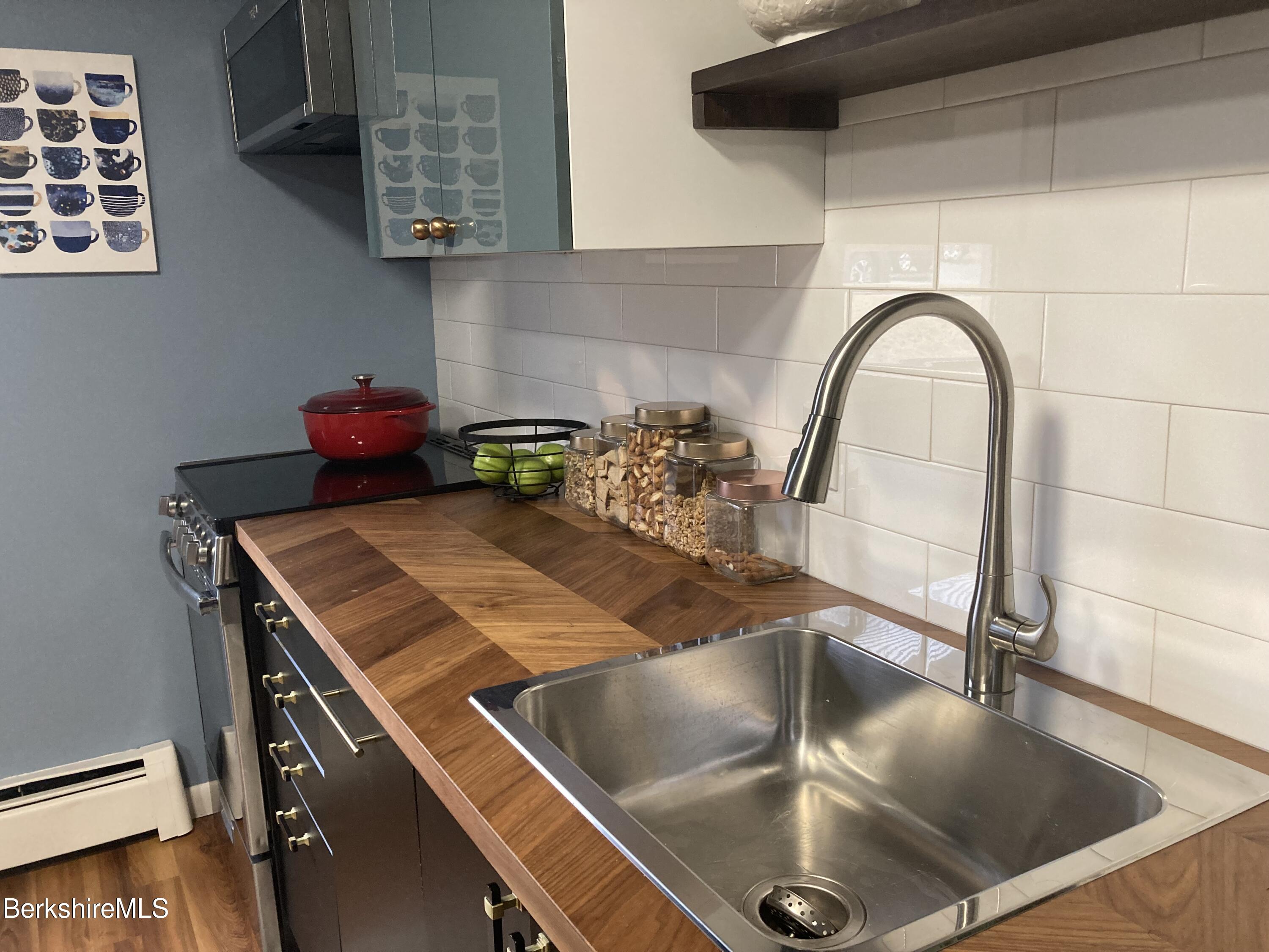2 Morgan Manor, Unit 6 Lenox, MA 01240 - Photo 16 of 32 a kitchen with a stove and a sink