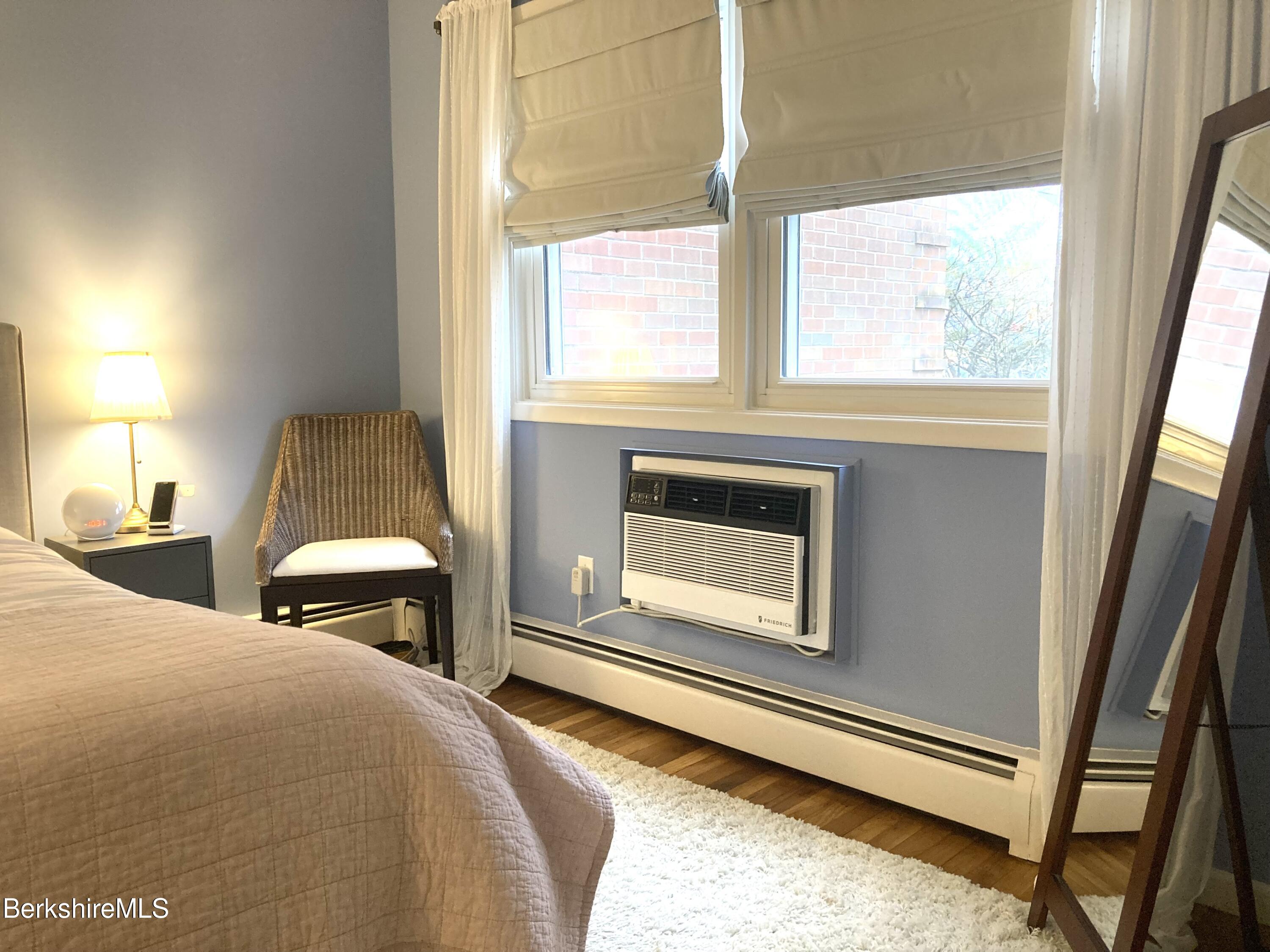 2 Morgan Manor, Unit 6 Lenox, MA 01240 - Photo 20 of 32 a bedroom with a bed and a fireplace