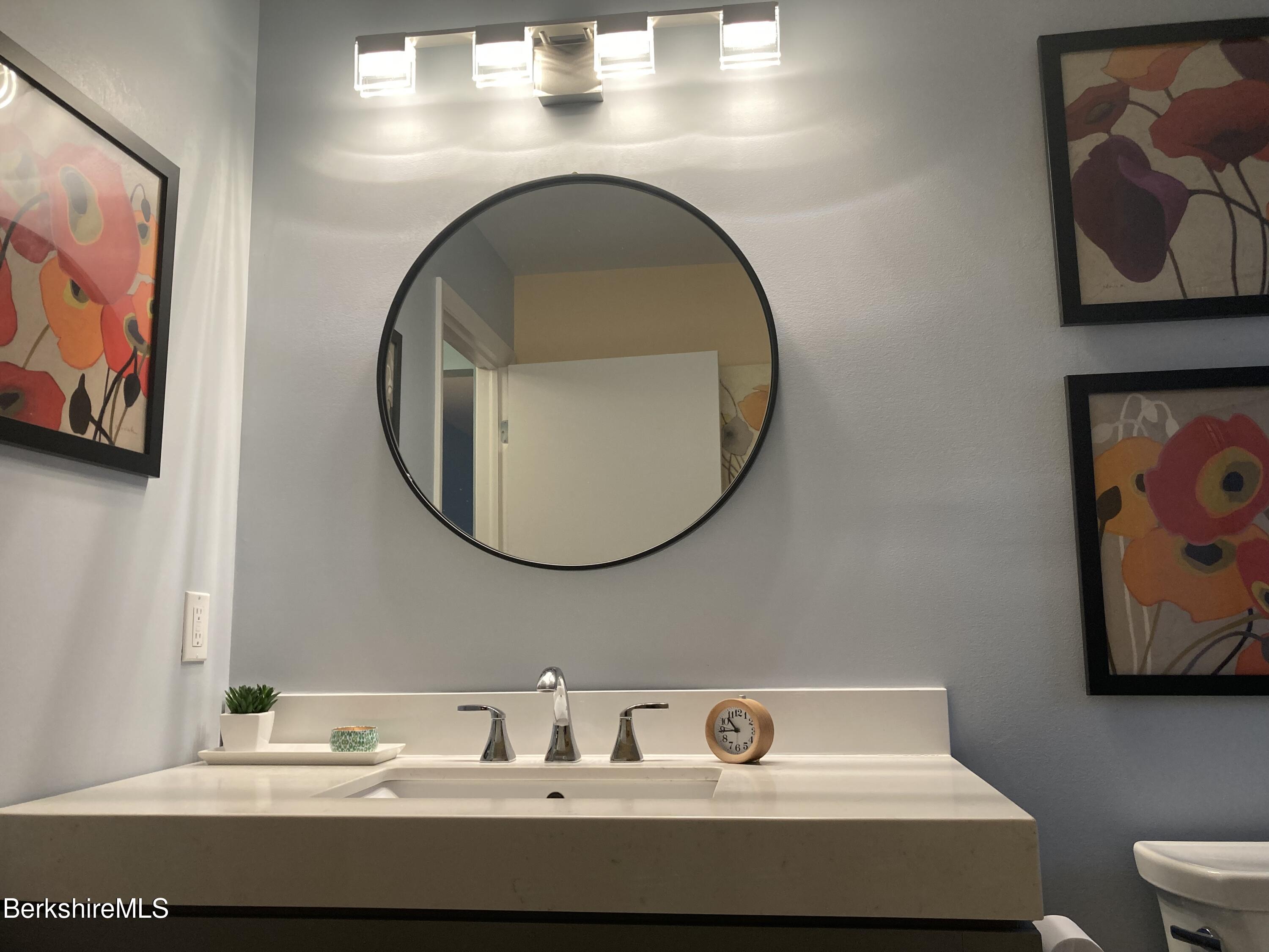 2 Morgan Manor, Unit 6 Lenox, MA 01240 - Photo 23 of 32 a bathroom with a sink and a mirror