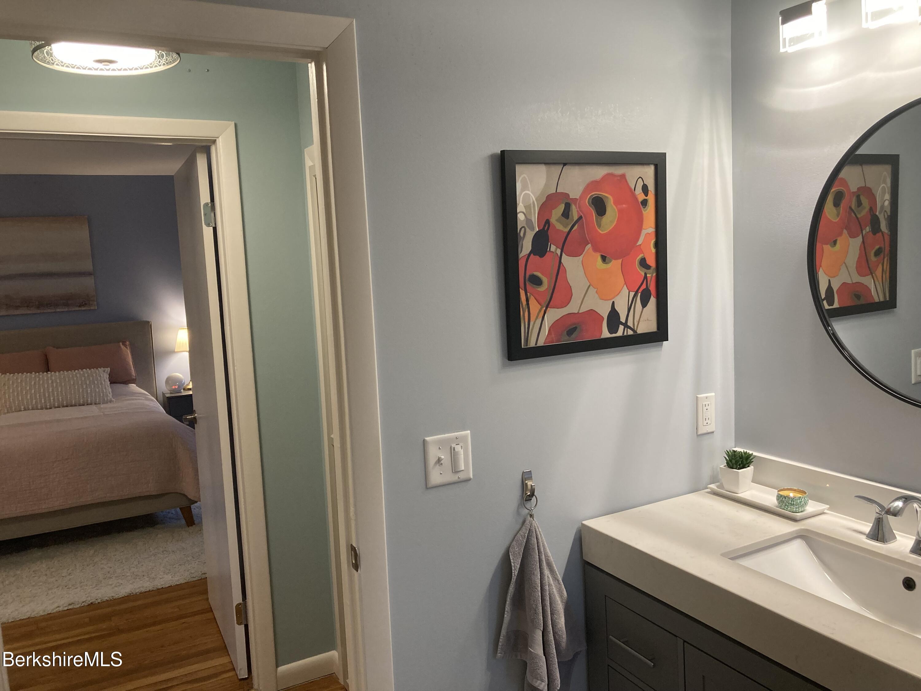 2 Morgan Manor, Unit 6 Lenox, MA 01240 - Photo 24 of 32 a bathroom with a sink and a mirror