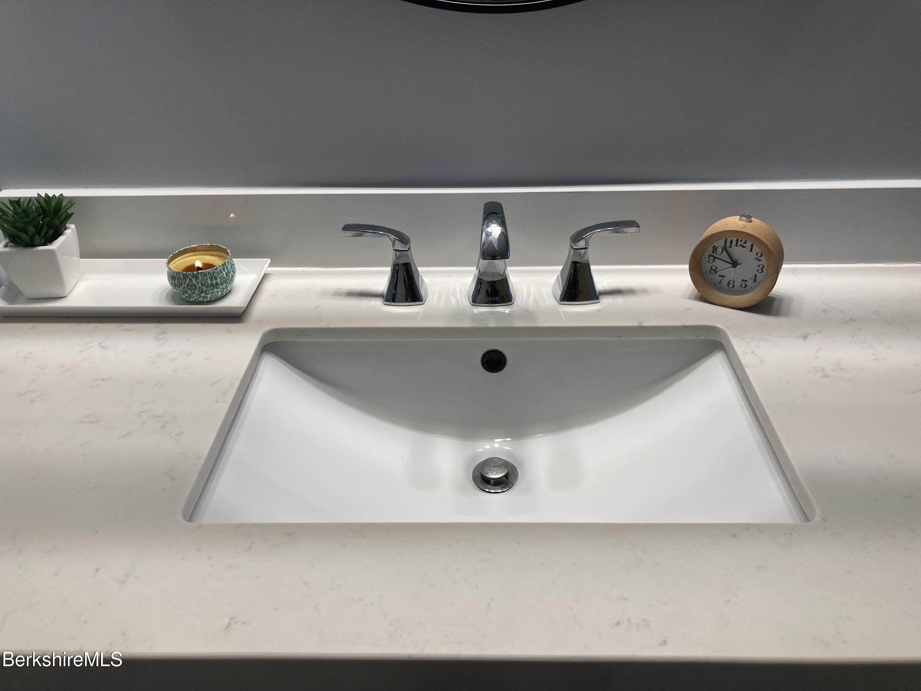 2 Morgan Manor, Unit 6 Lenox, MA 01240 - Photo 26 of 32 a bathroom with a sink and a mirror