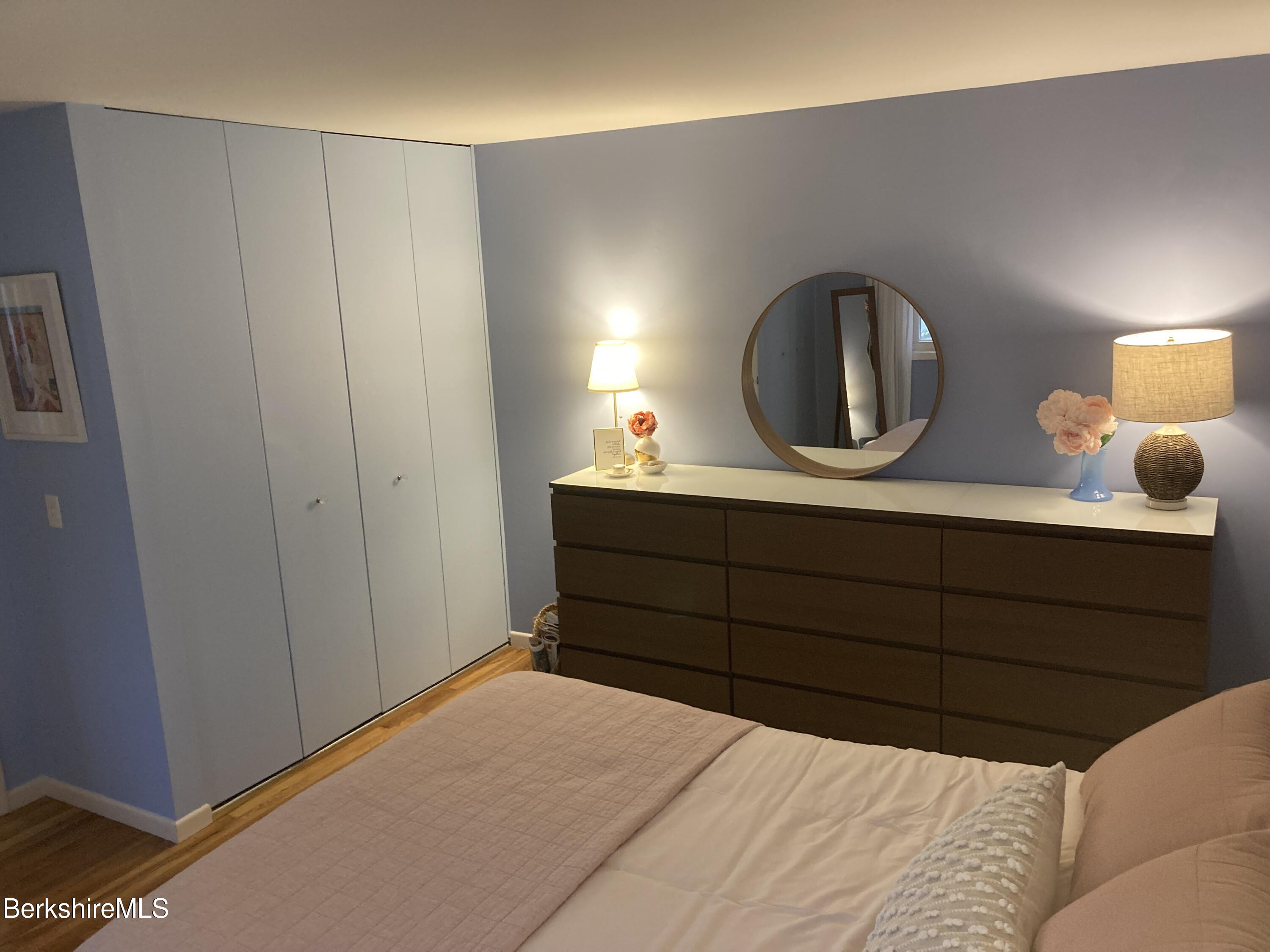 2 Morgan Manor, Unit 6 Lenox, MA 01240 - Photo 27 of 32 a bedroom with a bed and a dresser