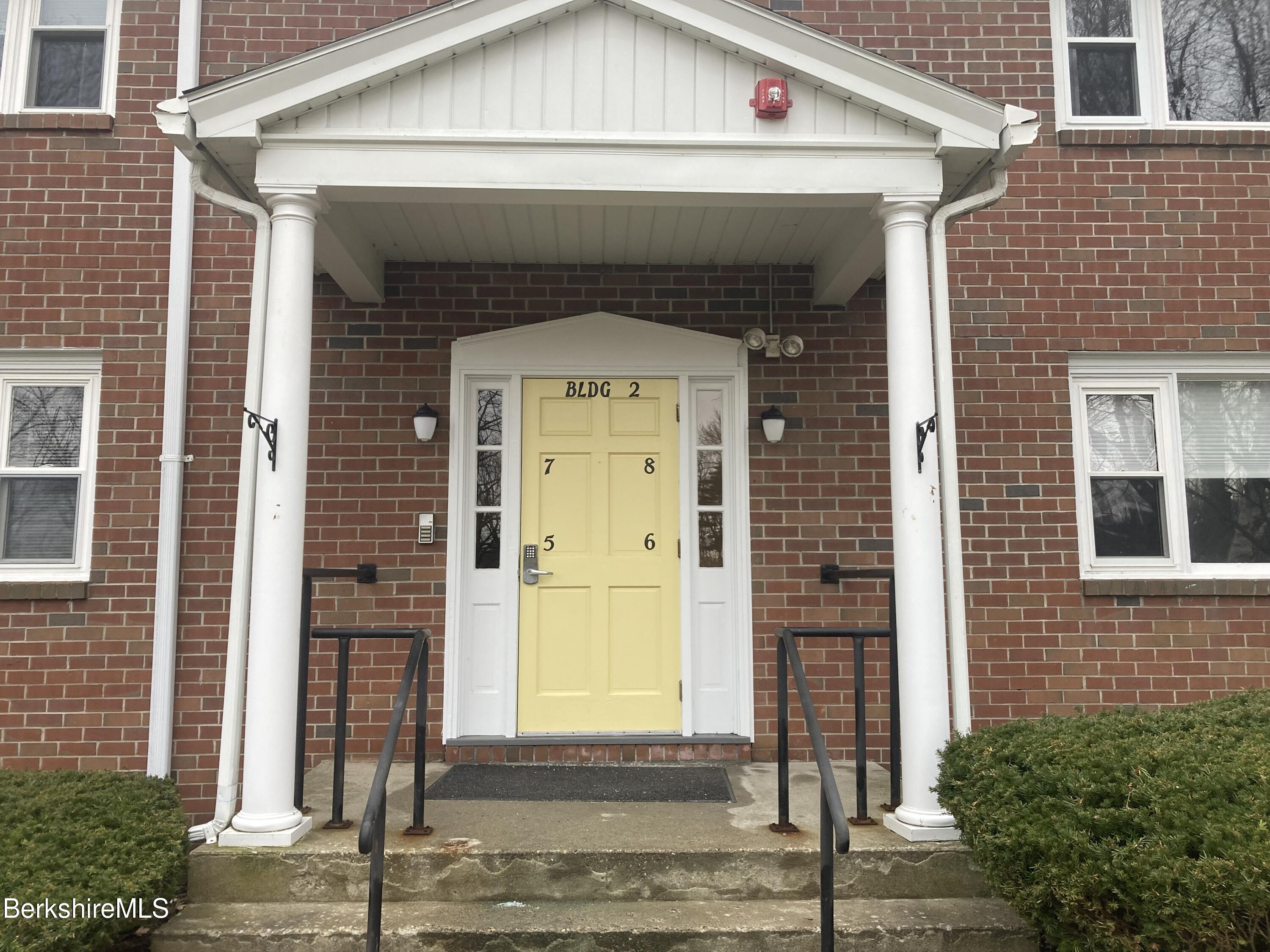 2 Morgan Manor, Unit 6 Lenox, MA 01240 - Photo 32 of 32 a front view of a house with a porch