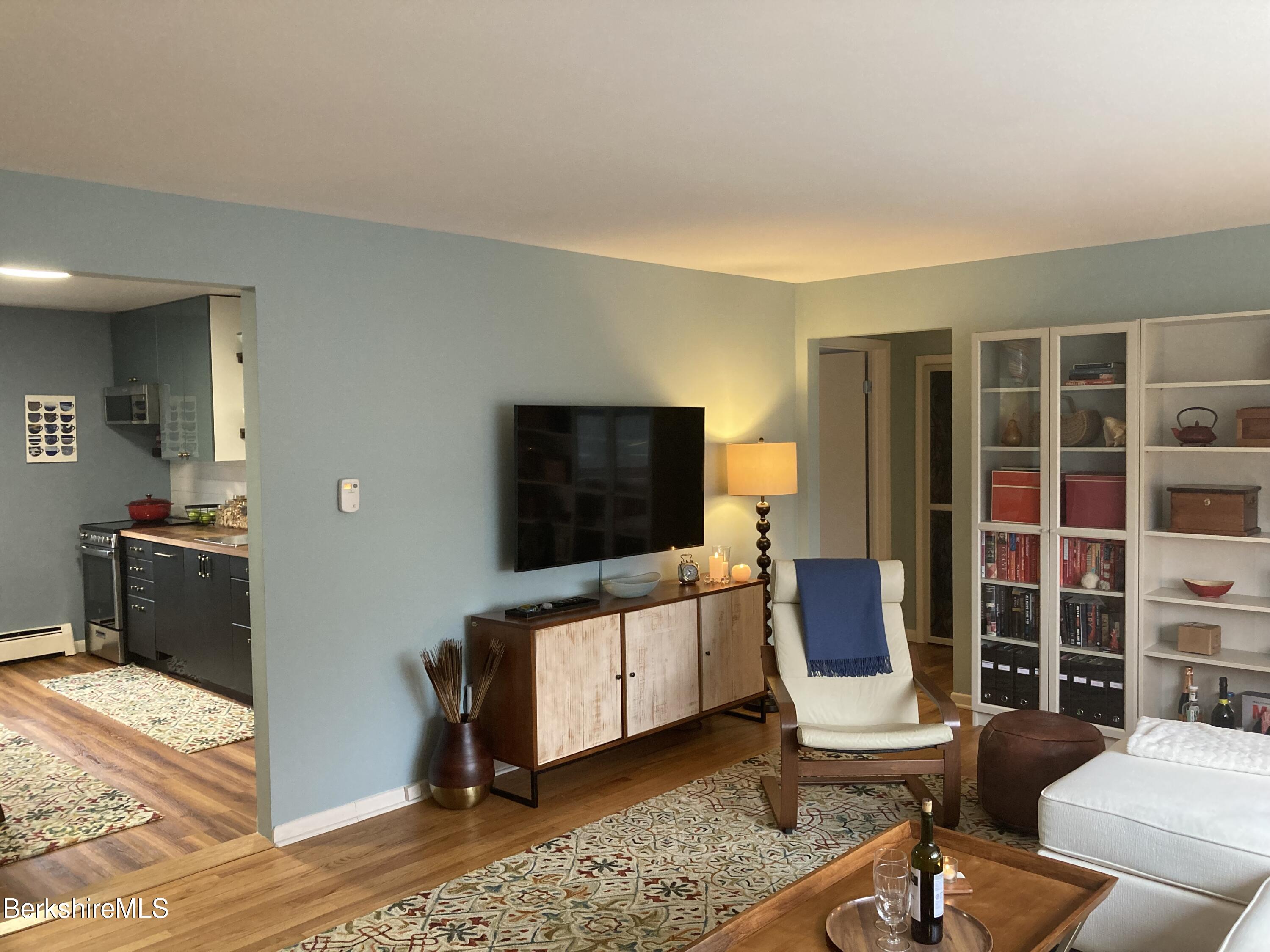 2 Morgan Manor, Unit 6 Lenox, MA 01240 - Photo 9 of 32 a living room with furniture and a flat screen tv