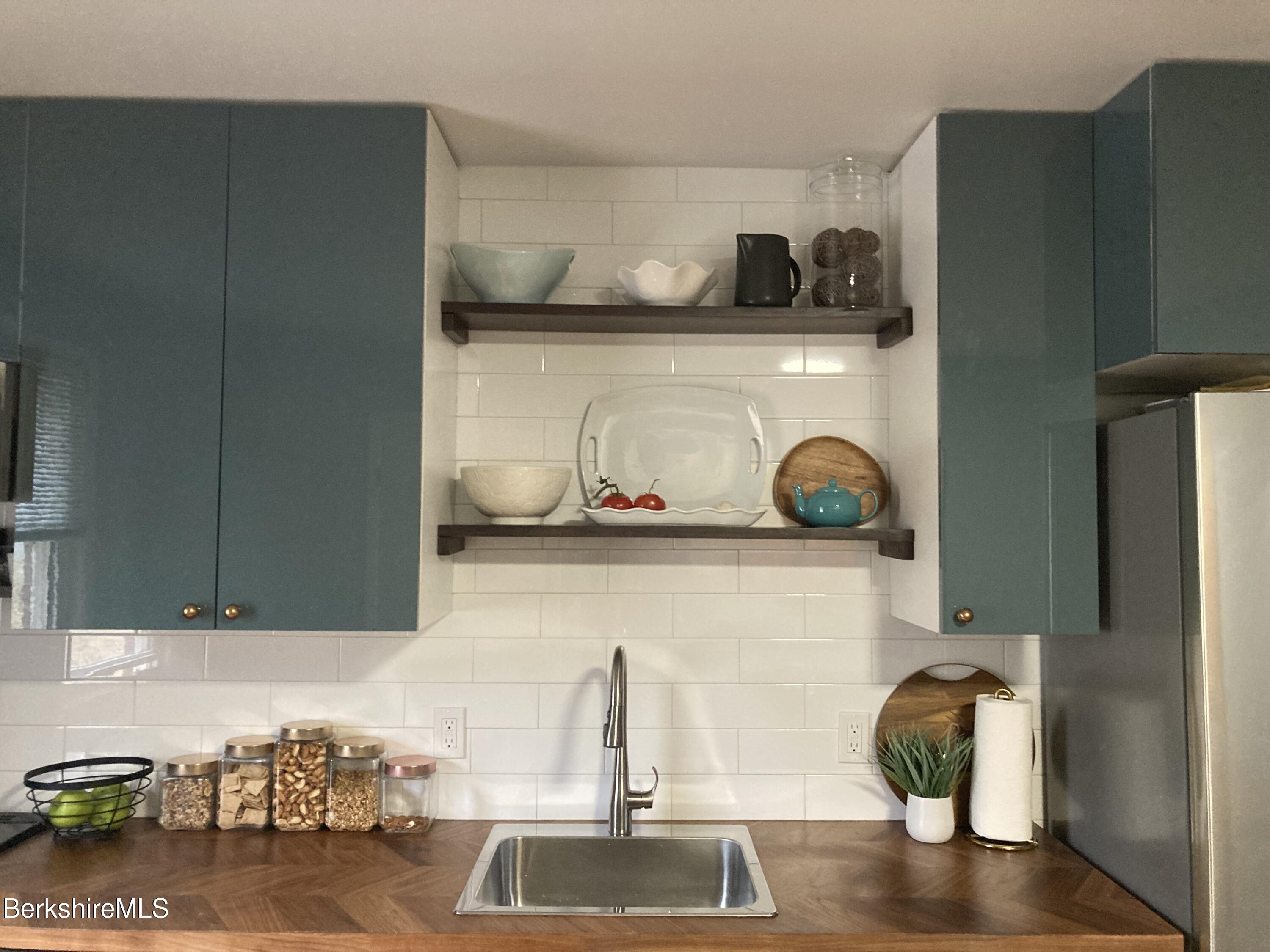 2 Morgan Manor, Unit 6 Lenox, MA 01240 - Photo 10 of 32 a kitchen with a sink and cabinets