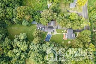 237 Amboy Road Old Bridge, NJ 07747 - Photo 2 of 39 a view of a garden with large trees