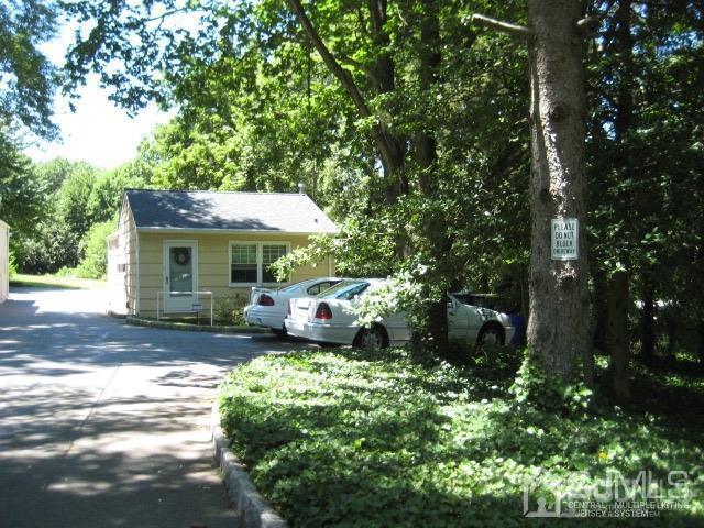 237 Amboy Road Old Bridge, NJ 07747 - Photo 26 of 39 a front view of a house with garden