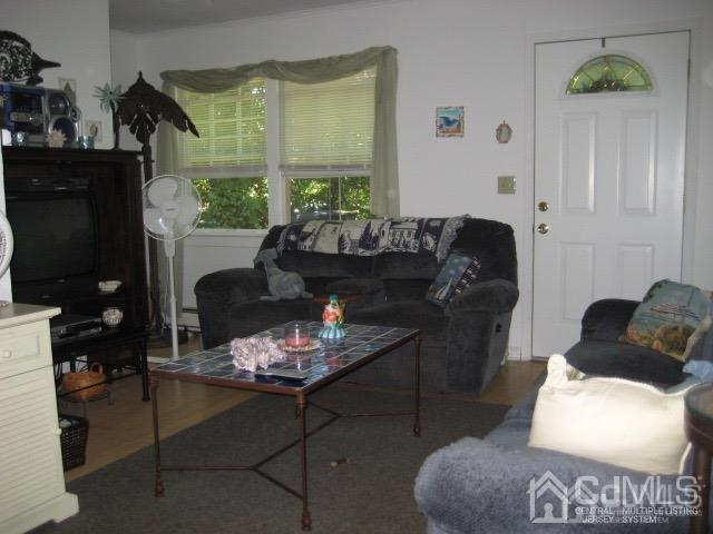 237 Amboy Road Old Bridge, NJ 07747 - Photo 29 of 39 a living room with furniture and a fireplace