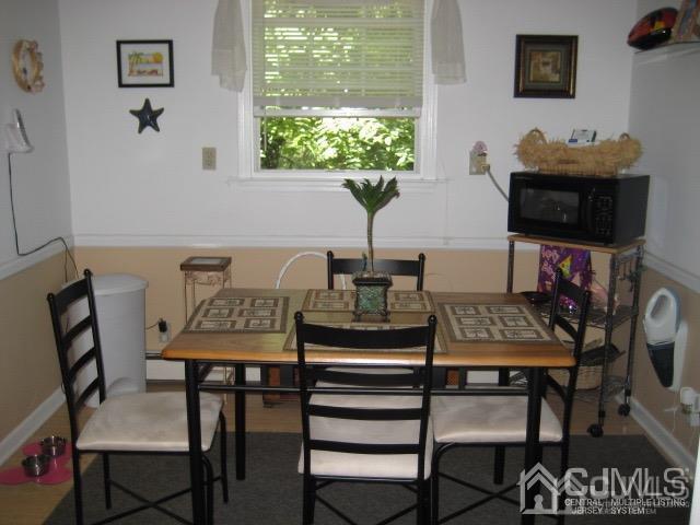 237 Amboy Road Old Bridge, NJ 07747 - Photo 31 of 39 a view of a dining room with furniture and wooden floor