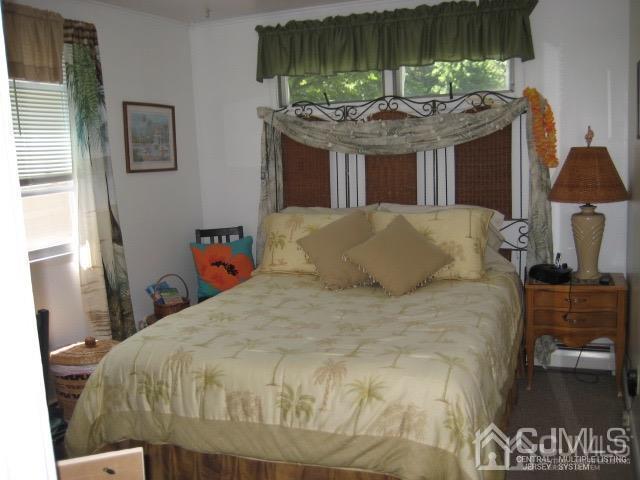 237 Amboy Road Old Bridge, NJ 07747 - Photo 32 of 39 a bed sitting in a bedroom next to a window