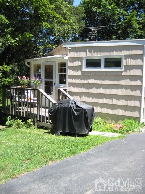 237 Amboy Road Old Bridge, NJ 07747 - Photo 34 of 39 a view of a house with a yard and a garden