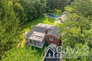 237 Amboy Road Old Bridge, NJ 07747 - Photo 4 of 39 an aerial view of a house with swimming pool and garden