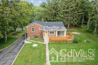 237 Amboy Road Old Bridge, NJ 07747 - Photo 6 of 39 a aerial view of a house with a big yard potted plants and large tree