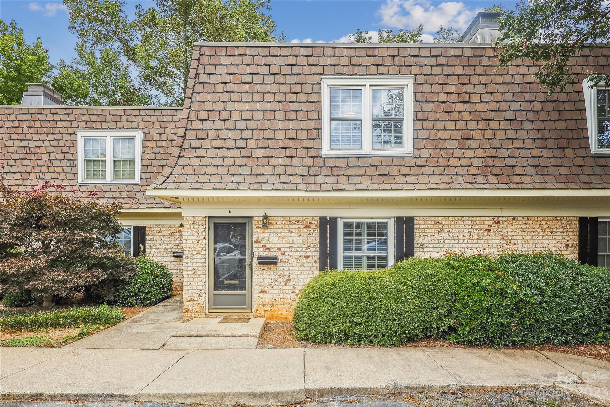 3504 Colony Road, Unit N Charlotte, NC 28211 - Photo 1 of 40 a view of a house with a yard