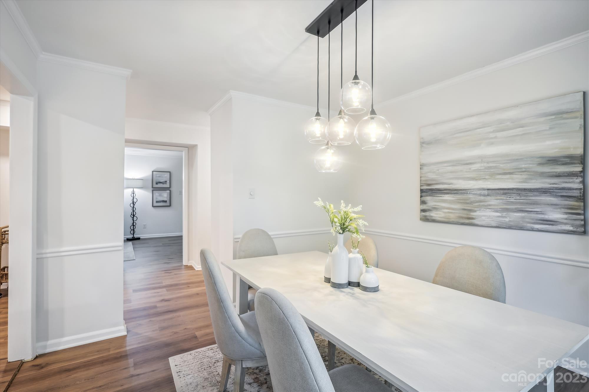 3504 Colony Road, Unit N Charlotte, NC 28211 - Photo 10 of 40 a dining room with furniture and chandelier