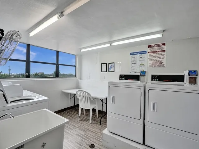a view of door with wooden wall
