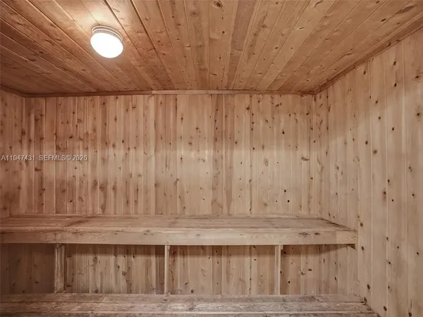 a front view of a house with a yard and a garage