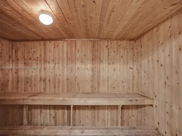 a front view of a house with a yard and a garage