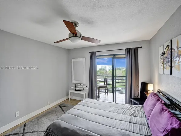 a view of a room with furniture and window