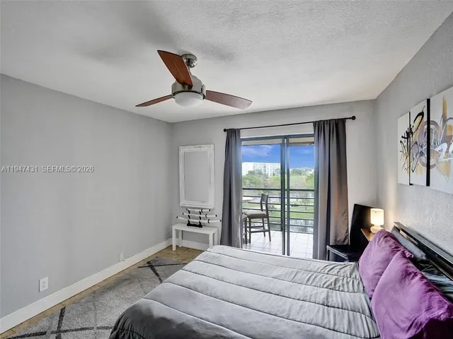 a view of a room with furniture and window