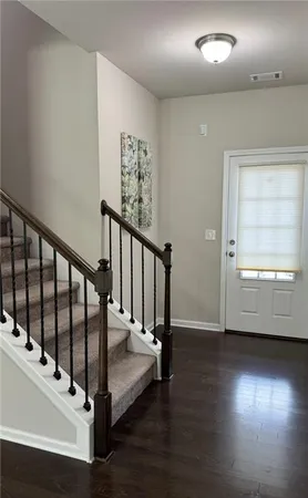a view of entryway with wooden floor