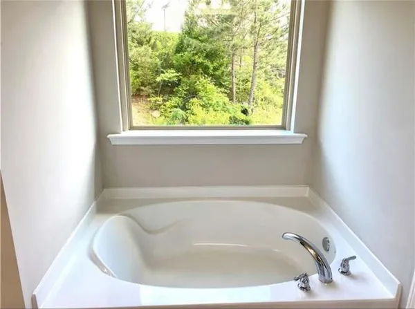 a white bath tub sitting in a bathroom
