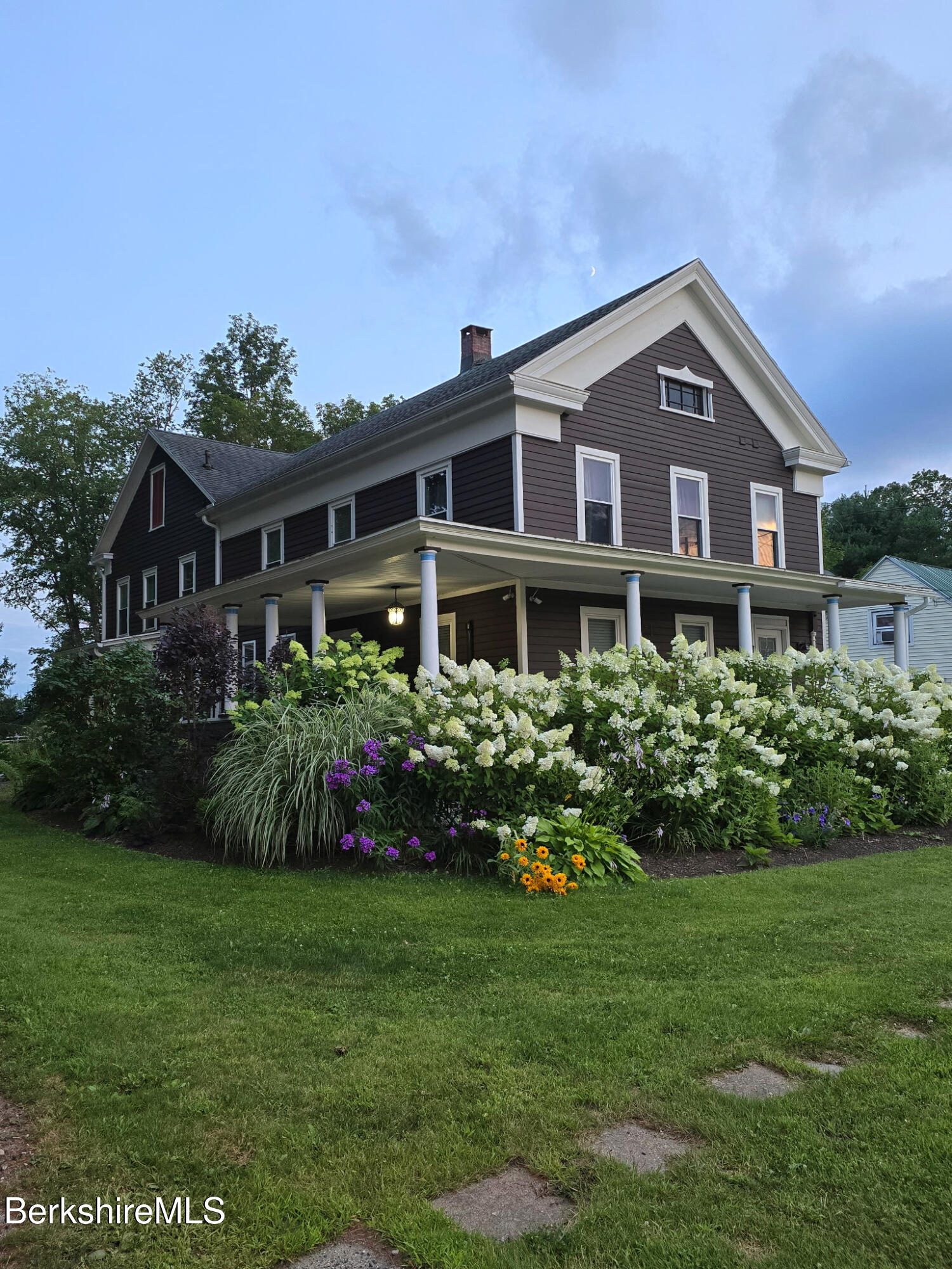 396 Maple Street Hinsdale, MA 01235 - Photo 2 of 47 a front view of a house with a garden