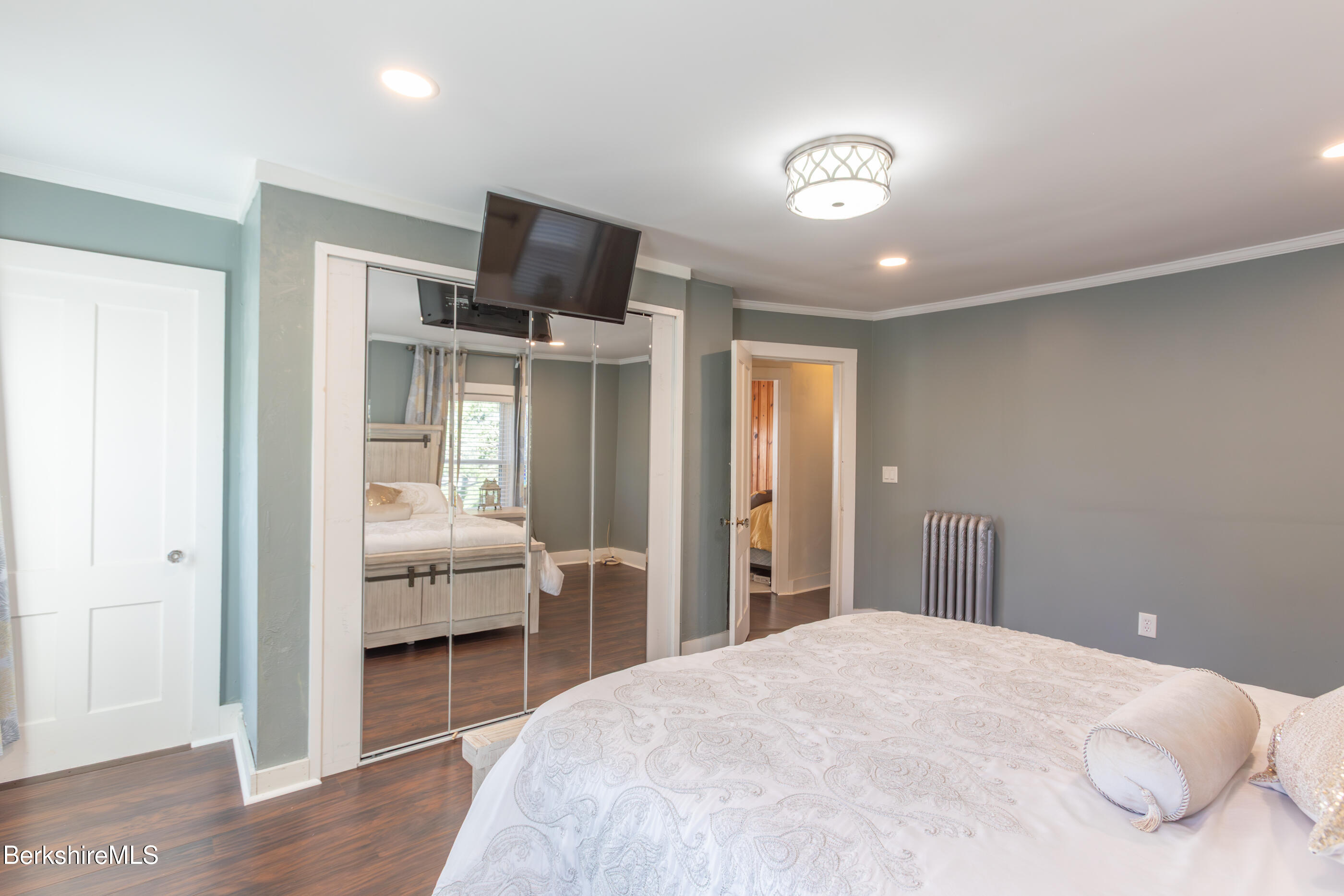 396 Maple Street Hinsdale, MA 01235 - Photo 25 of 47 a bedroom with a bed and a television