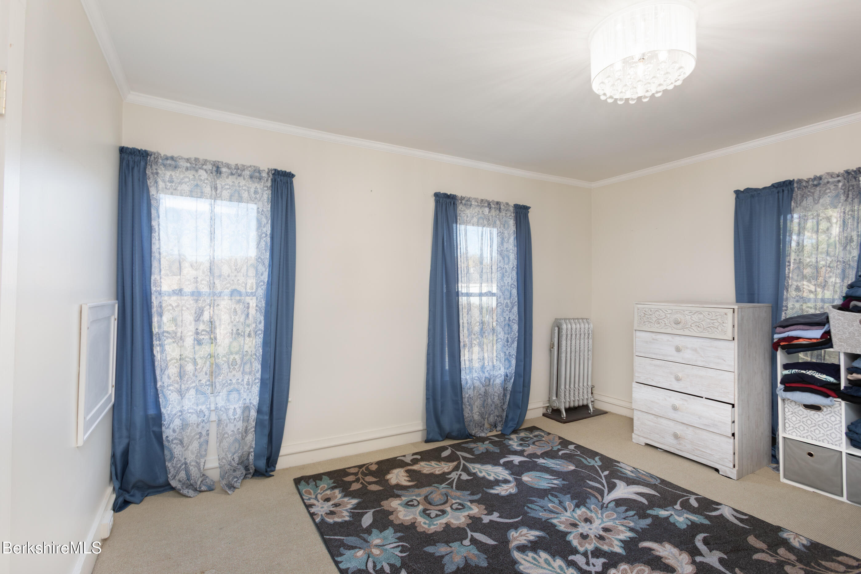 396 Maple Street Hinsdale, MA 01235 - Photo 28 of 47 a bedroom with a bed and a mirror