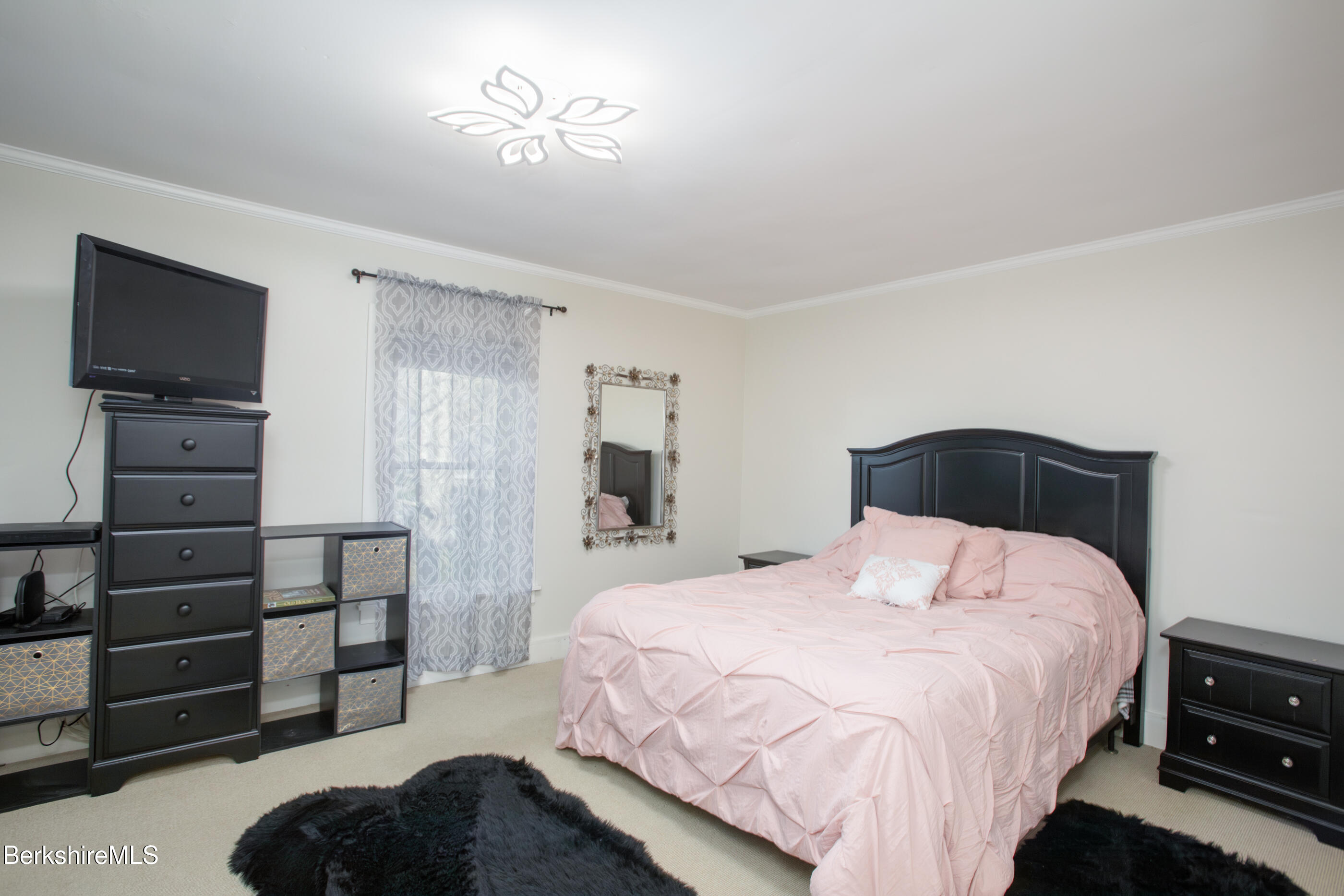 396 Maple Street Hinsdale, MA 01235 - Photo 30 of 47 a bedroom with a bed and a television