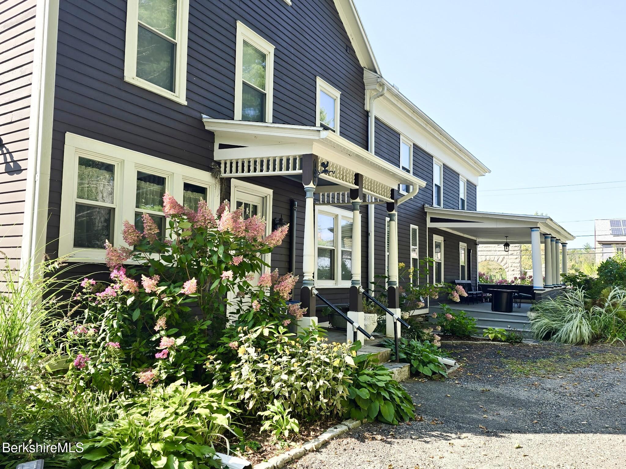 396 Maple Street Hinsdale, MA 01235 - Photo 3 of 47 a front view of a house with a yard