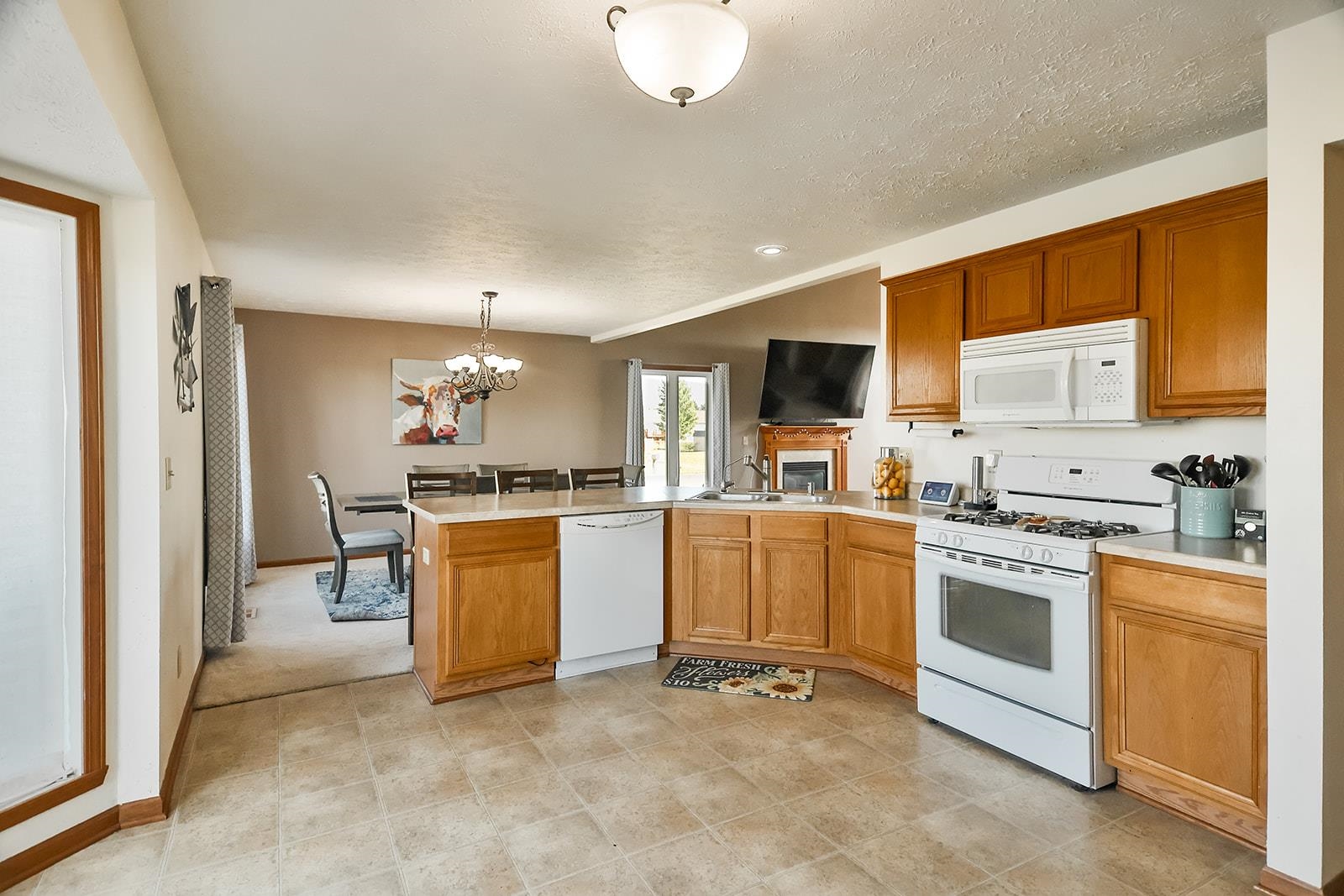 381 Red Fox Drive Davis Junction, IL 61020 - Photo 18 of 38 a kitchen with white cabinets and white appliances
