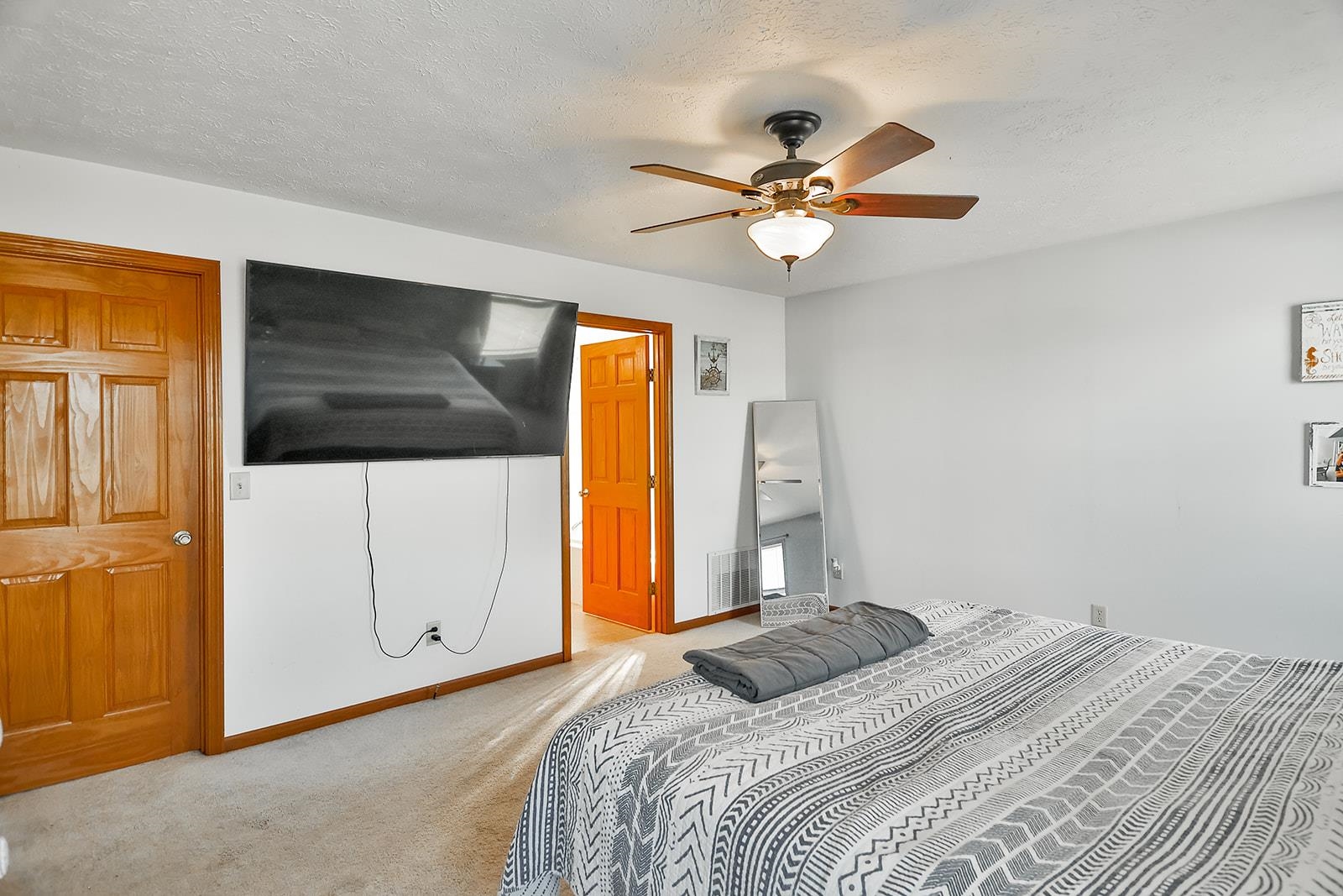 381 Red Fox Drive Davis Junction, IL 61020 - Photo 21 of 38 a bedroom with a bed and a chandelier