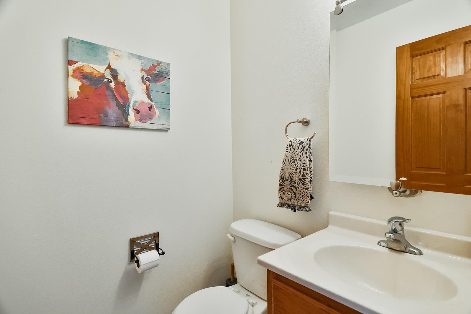 381 Red Fox Drive Davis Junction, IL 61020 - Photo 25 of 38 a bathroom with a toilet a sink and mirror