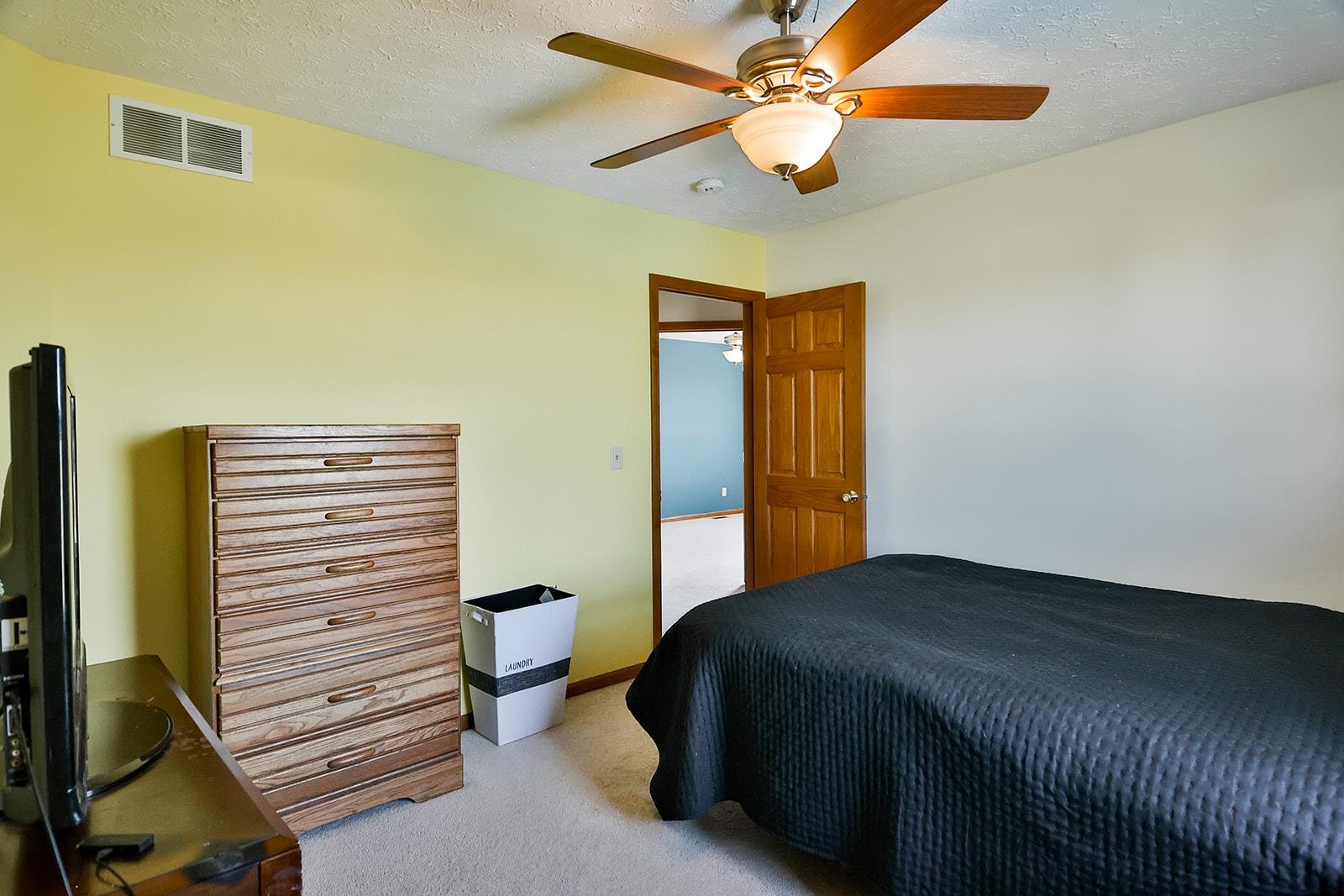 381 Red Fox Drive Davis Junction, IL 61020 - Photo 34 of 38 a bedroom with a bed and a chandelier
