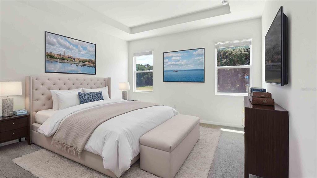 12773 Northwest 13th Lane Gainesville, FL 32606 - Photo 4 of 24 a bedroom with a bed and a flat screen tv