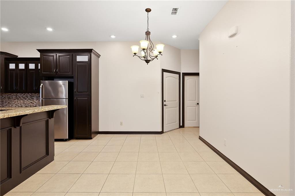 7027 North 3rd Street, Unit 7027 McAllen, TX 78504 - Photo 5 of 14 a view of a kitchen with a sink and dishwasher