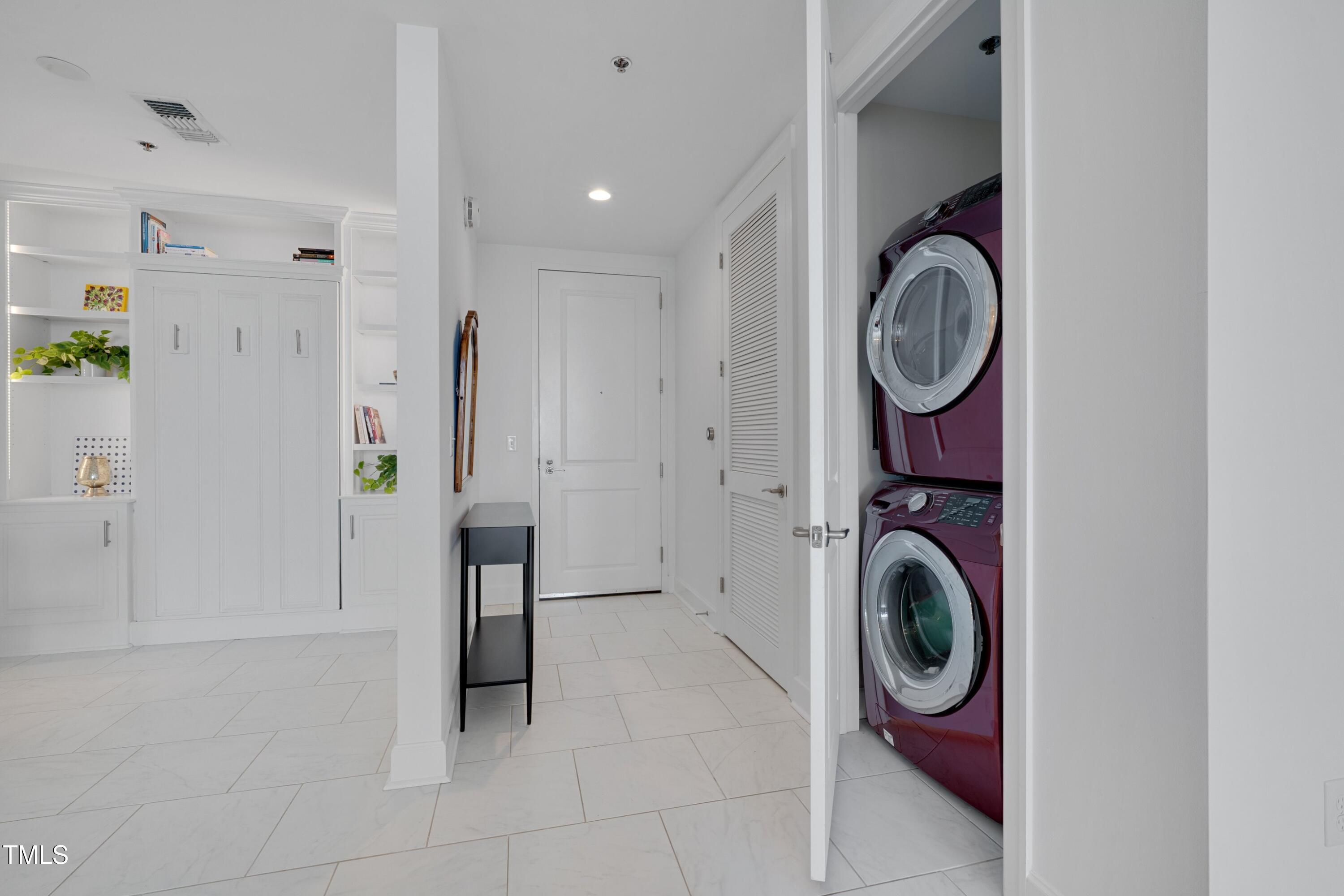 301 Fayetteville Street, Unit 2611 Raleigh, NC 27601 - Photo 18 of 44 a view of a hallway with washer and dryer
