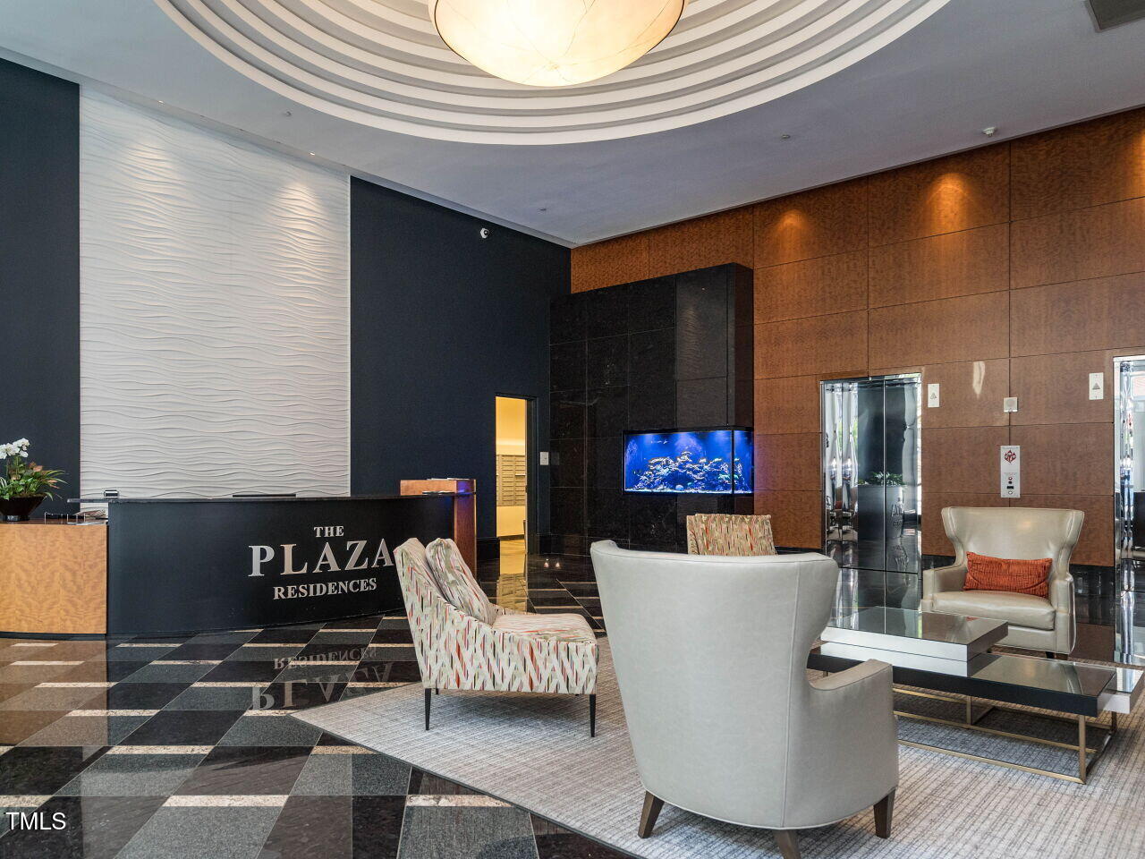 301 Fayetteville Street, Unit 2611 Raleigh, NC 27601 - Photo 34 of 44 a living room with couches and a dining table with kitchen view
