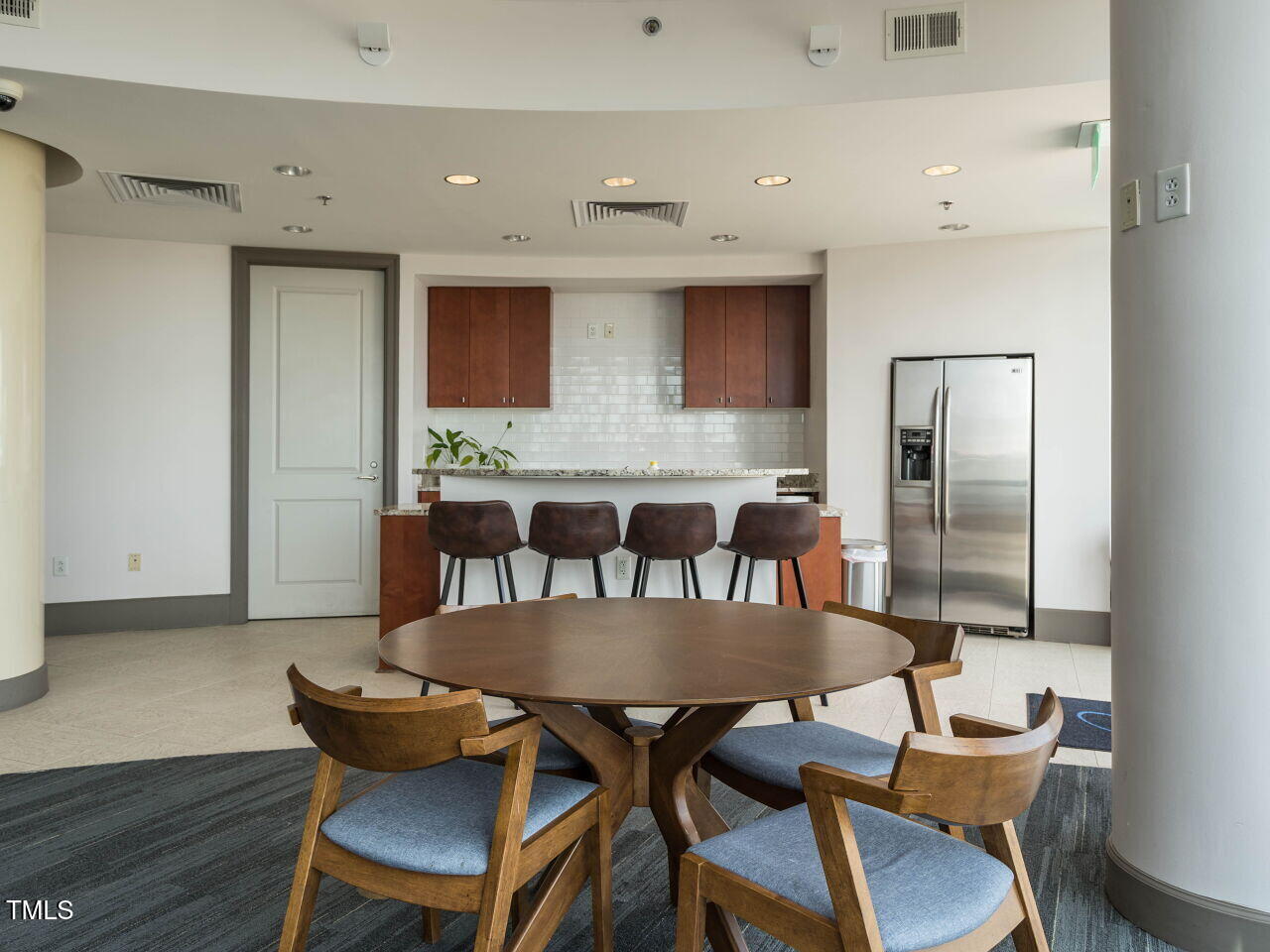 301 Fayetteville Street, Unit 2611 Raleigh, NC 27601 - Photo 38 of 44 a view of a dining room with furniture and wooden floor