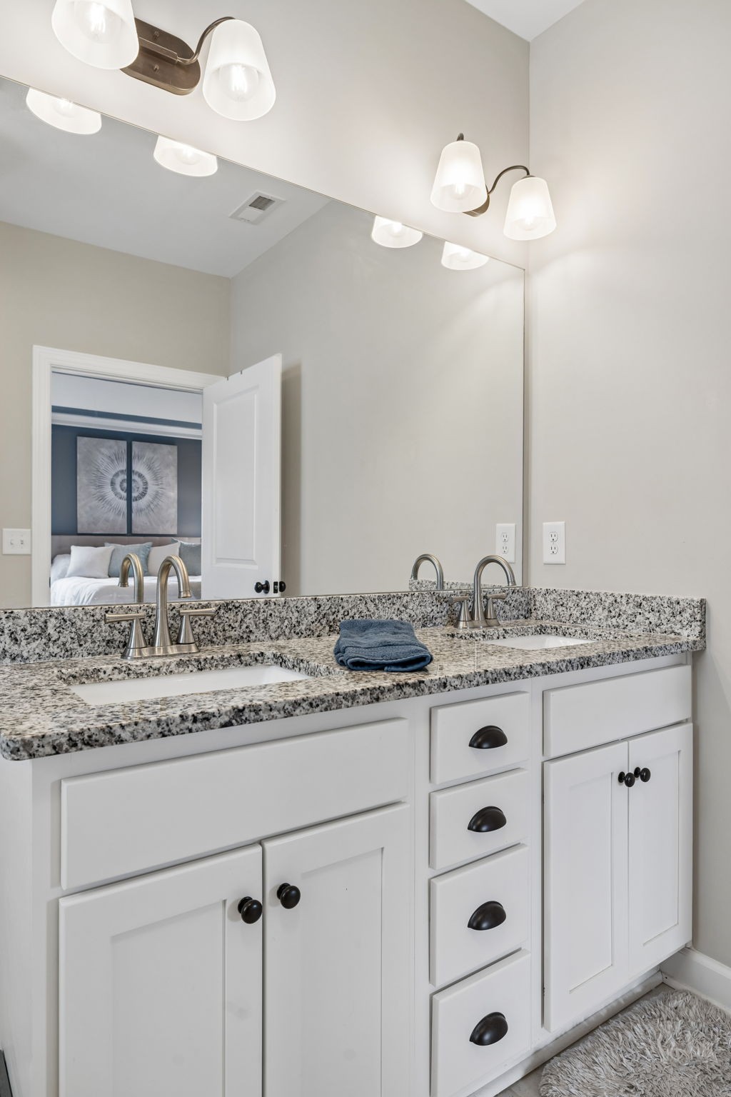 1002 Garrison Way Spring Hill, TN 37174 - Photo 45 of 63 a bathroom with a granite countertop sink and a mirror