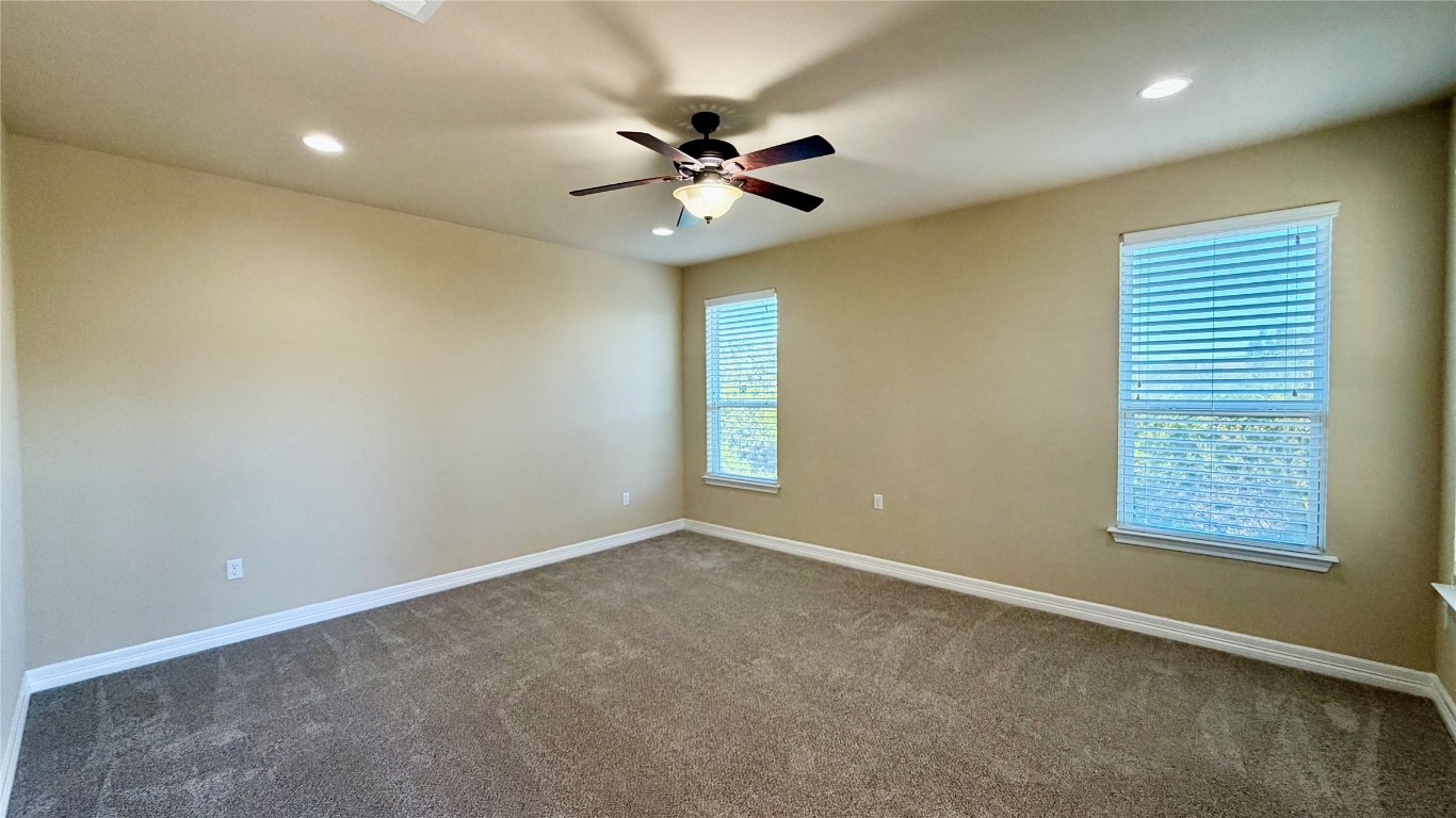 12300 Terraza Circle, Unit TH10 Austin, TX 78726 - Photo 8 of 36 a view of an empty room with a window