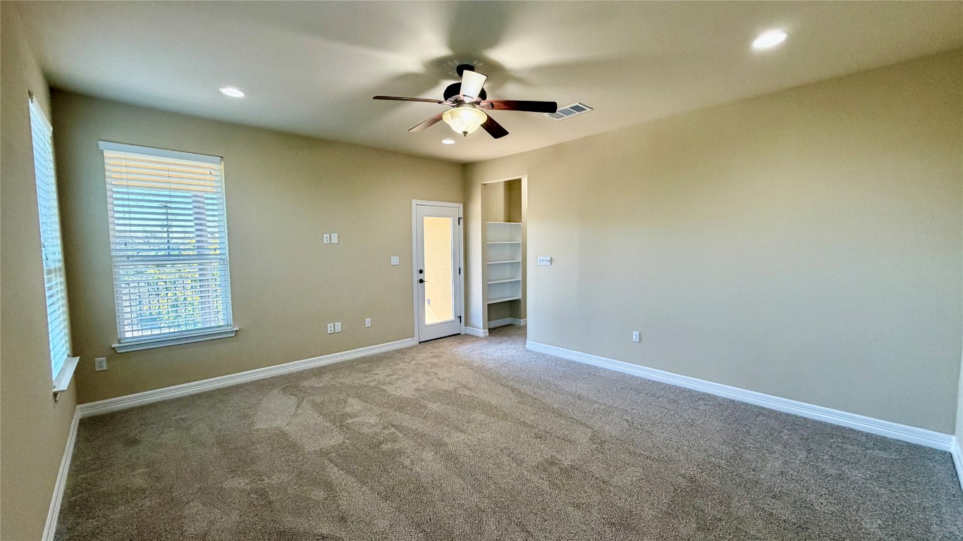 12300 Terraza Circle, Unit TH10 Austin, TX 78726 - Photo 9 of 36 en view of an empty room with a window