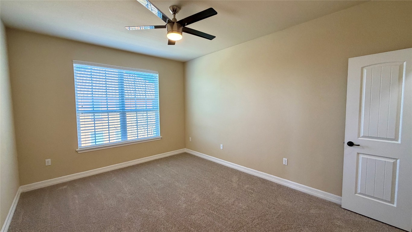 12300 Terraza Circle, Unit TH10 Austin, TX 78726 - Photo 10 of 36 a view of an empty room with a window