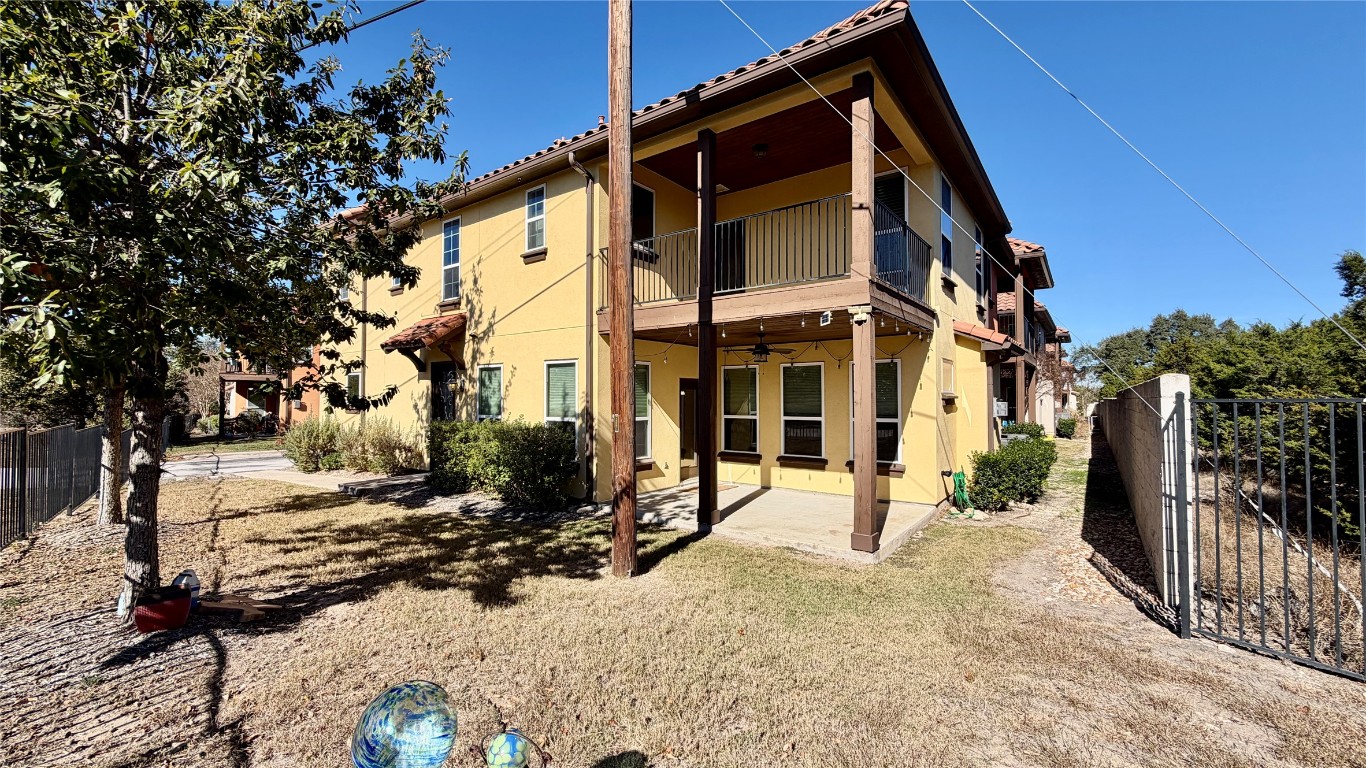 12300 Terraza Circle, Unit TH10 Austin, TX 78726 - Photo 25 of 36 a view of a house with a yard covered in snow
