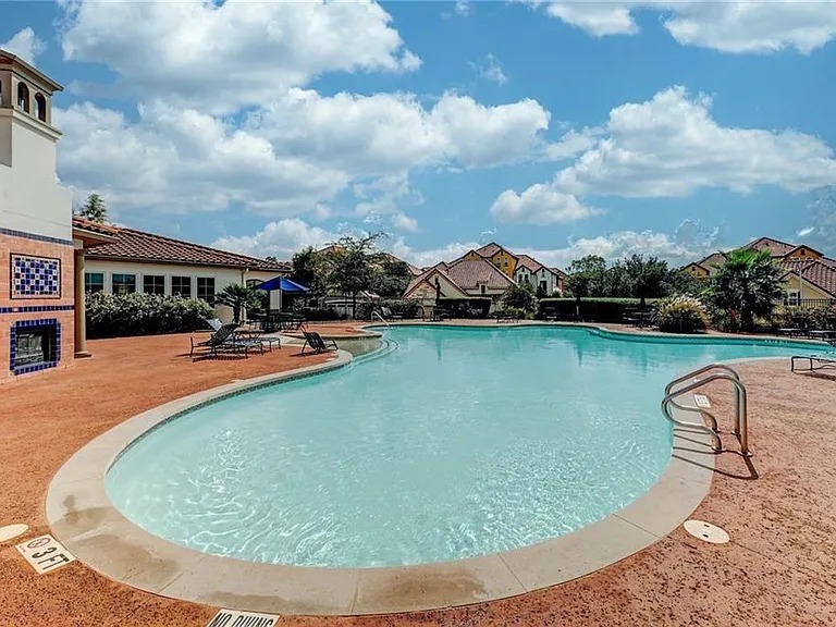 12300 Terraza Circle, Unit TH10 Austin, TX 78726 - Photo 27 of 36 a view of swimming pool from a yard