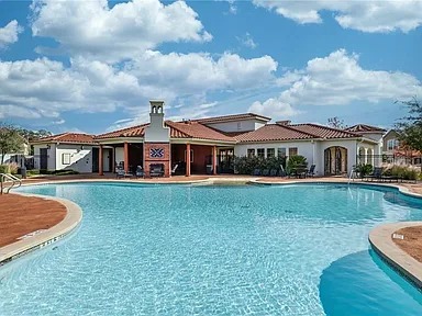 12300 Terraza Circle, Unit TH10 Austin, TX 78726 - Photo 28 of 36 a front view of a house with garden