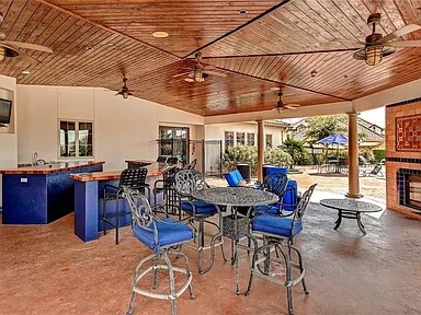 12300 Terraza Circle, Unit TH10 Austin, TX 78726 - Photo 30 of 36 a view of a dinning table and chairs in the patio