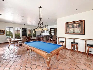 12300 Terraza Circle, Unit TH10 Austin, TX 78726 - Photo 31 of 36 a living room with furniture a rug and a flat screen tv