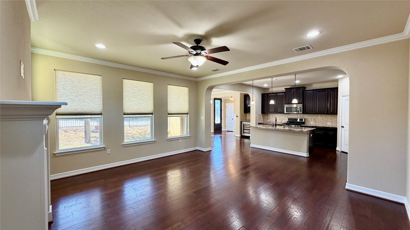 12300 Terraza Circle, Unit TH10 Austin, TX 78726 - Photo 36 of 36 a view of a big room with wooden floor and a kitchen